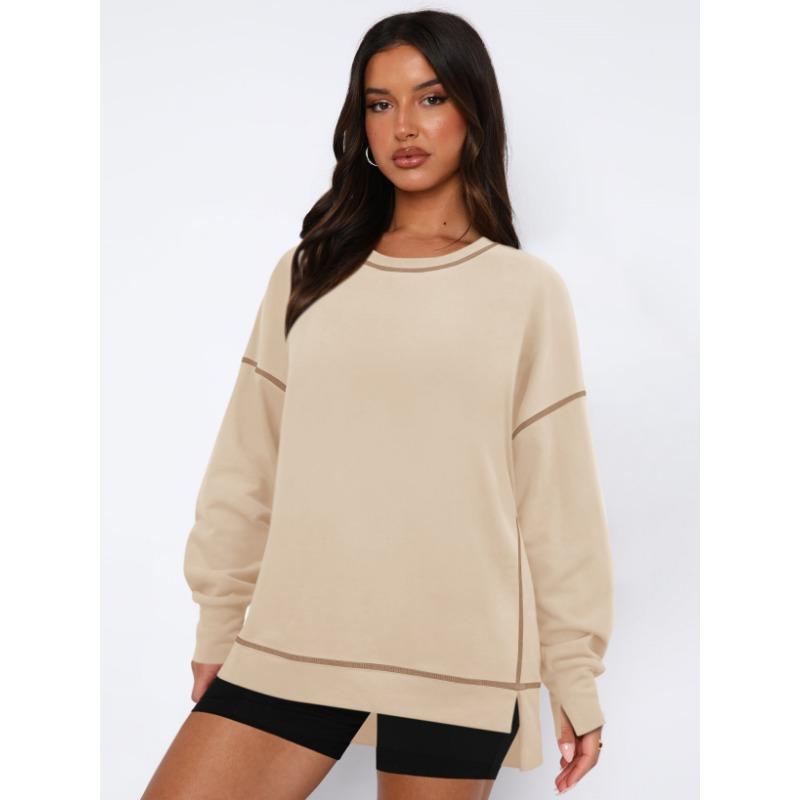 Женский контрастный пуловер свободного кроя с длинными рукавами с разрезами — фото 6