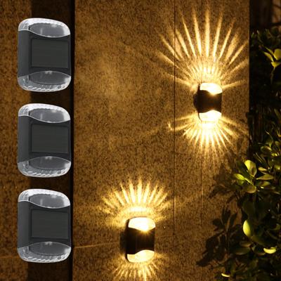 Nowa lampa ścienna Solar 4LED Shadow Outdoor Garden Dziedziniec Lampa dekoracyjna Domowa balkonowa lampka nocna Wodoodporna górna i dolna świecąca kinkiet
