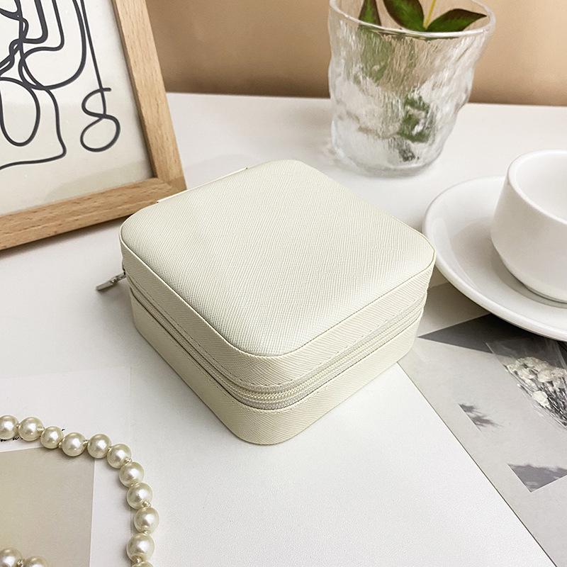 

Портативная дорожная шкатулка для хранения ювелирных изделий из ПУ с молнией для серег и пуссет