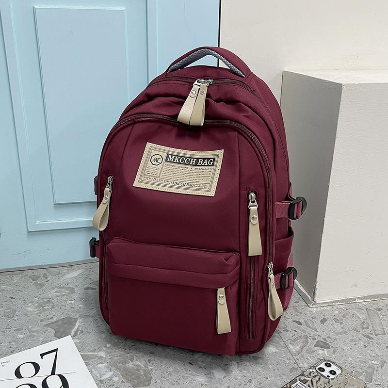 

New large-capacity backpack men s and women s high-value casual schoolbag, junior high school college student backpack fashion