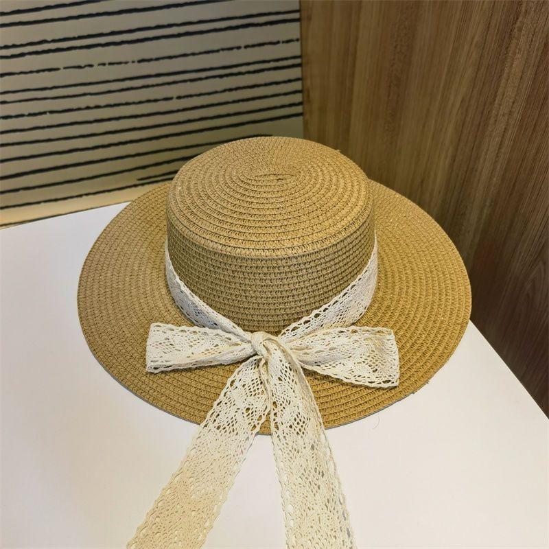 Flat top straw hat women's beach sunscreen bow top hat photo vacation straw weaving simple temperament sun hat