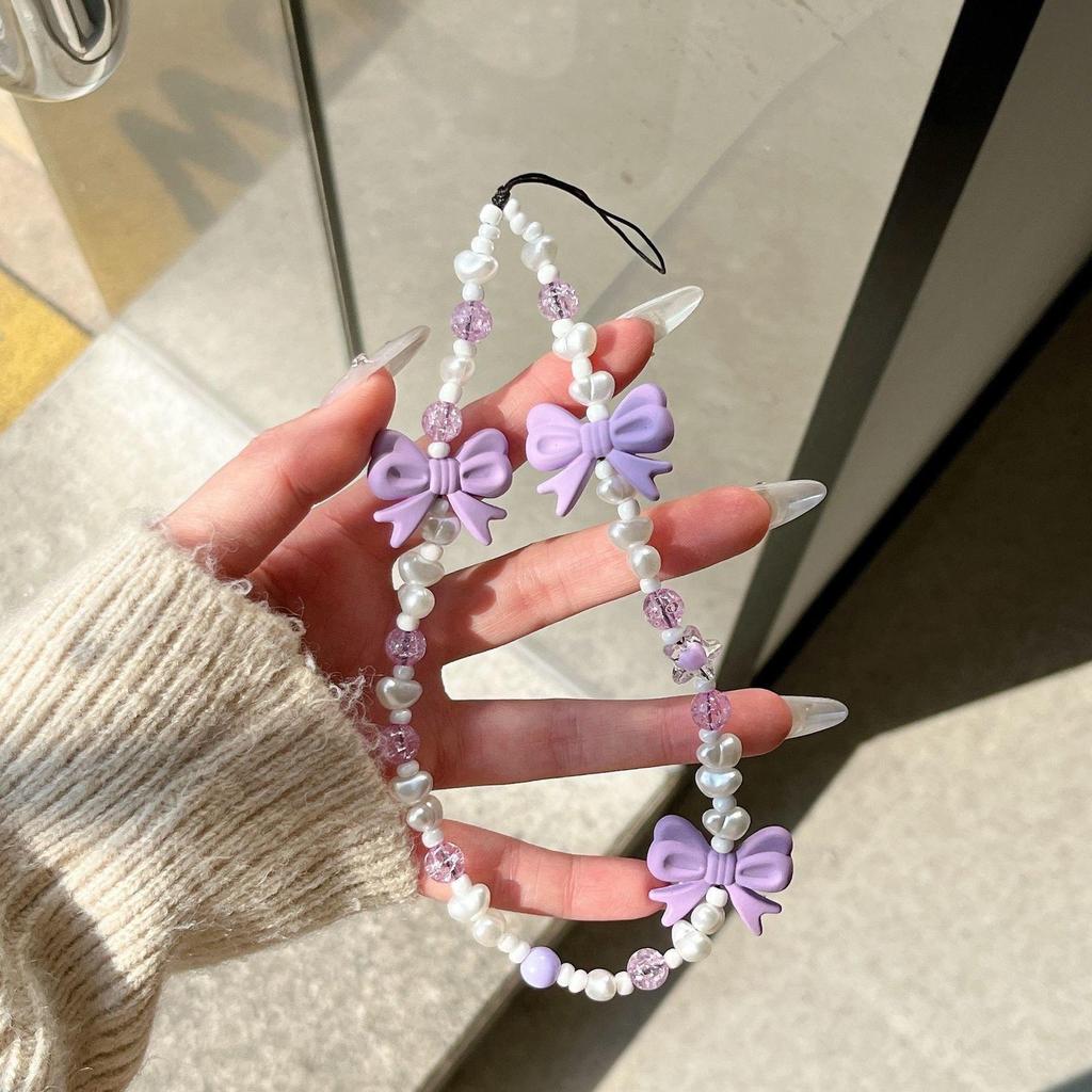 DIY pequeño lazo de cristal fresco flores amor pulsera de perlas amor de las mujeres cadena de teléfono móvil anti-caída accesorios de carcasa de teléfono móvil