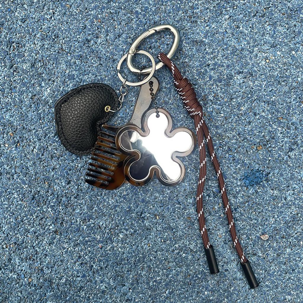 Kreative Designs Multifunktionaler Schlüsselanhänger Kamm Spiegel Tragbares Haarwerkzeug und Kosmetikzubehör für den täglichen Gebrauch