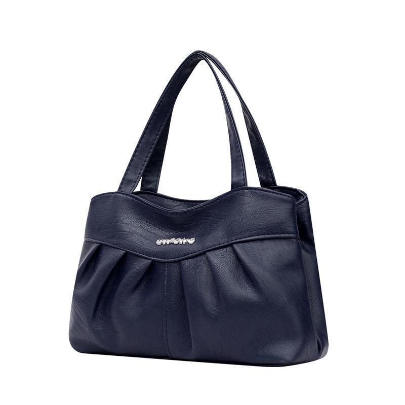 A Lady Commutes To and From Work with Her Mother's Bag In Hand