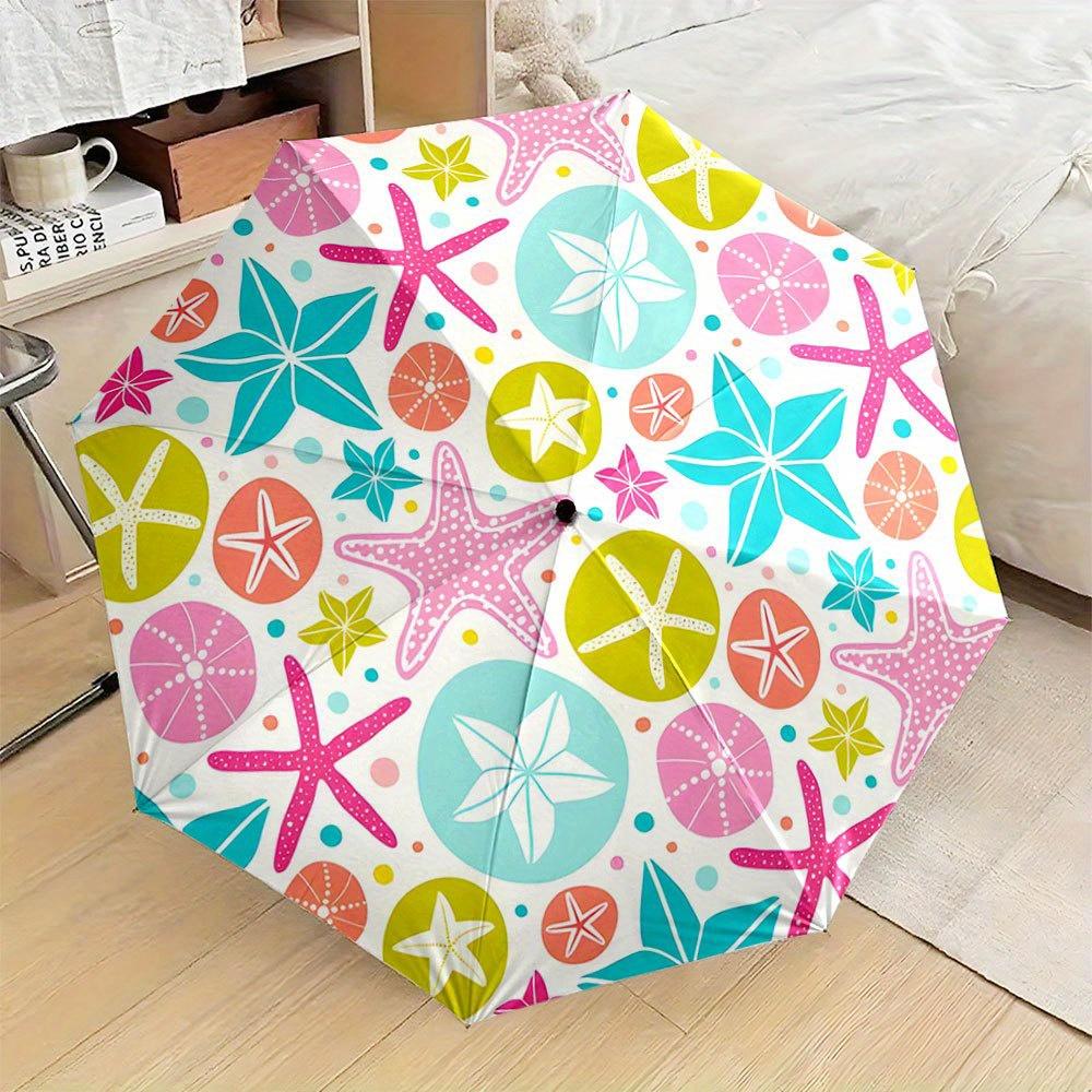 

Folding Umbrella The umbrella features colorful starfish and sand dollar patterns in pink, teal, and yellow shades. Fits Trave Iron&8K