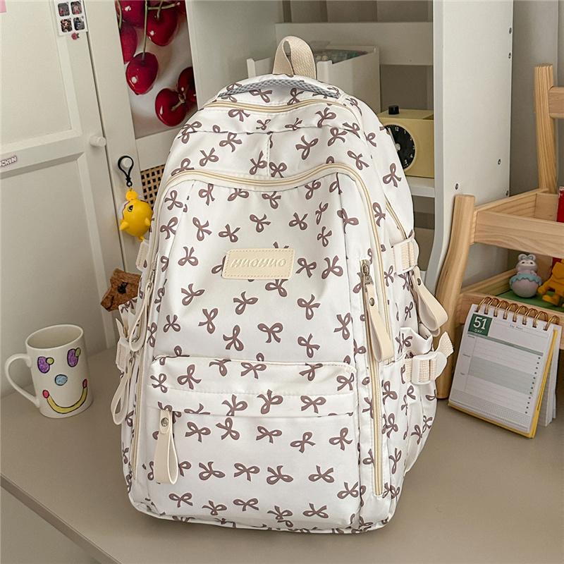 Cute Bow Print Backpack for Women Lightweight Casual Daypack Travel School Bag with Multi Pockets
