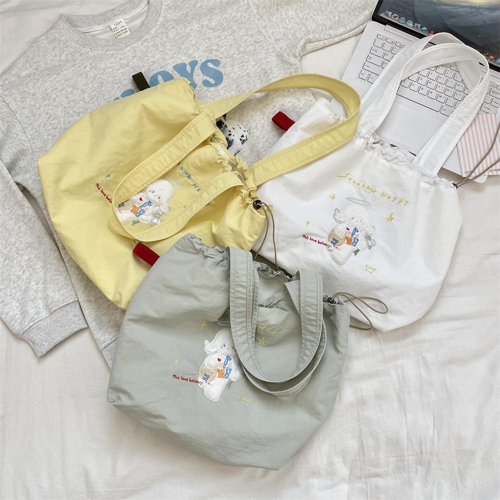 Canvas bag Large capacity women's embroidery lamb fabric bag Simple versatile drawstring bundle shoulder bag
