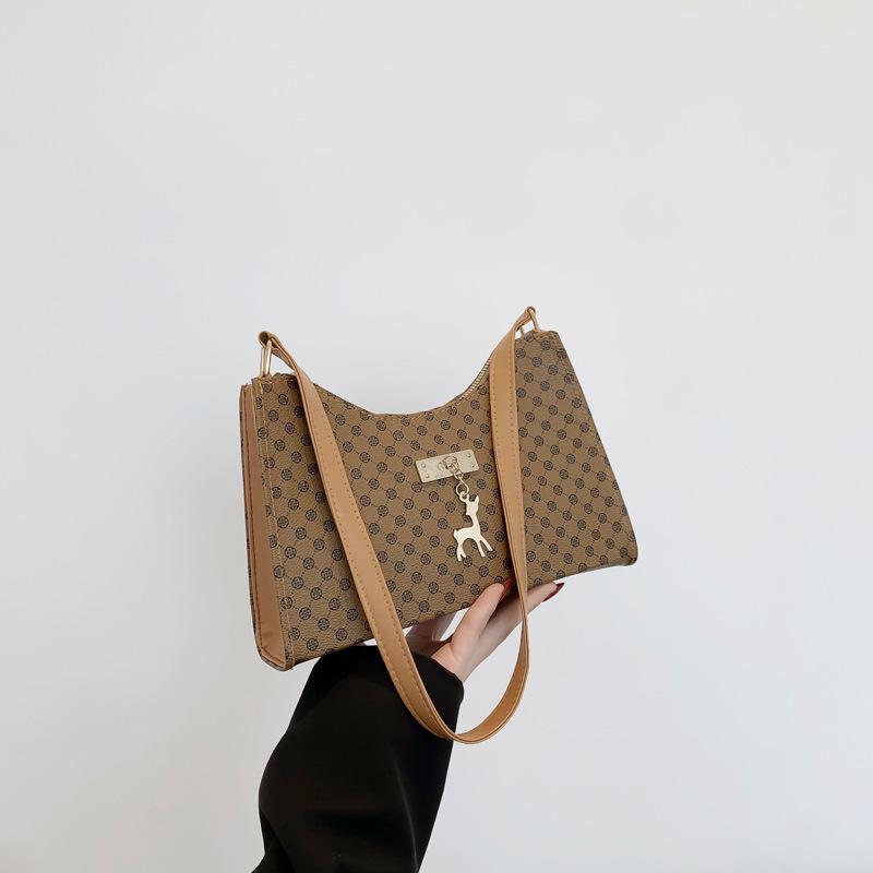 

Популярний нішевий дизайн жіноча 2024 весна нова друкована на плече проста сумка під пахву модна текстура картата сумочка хакі