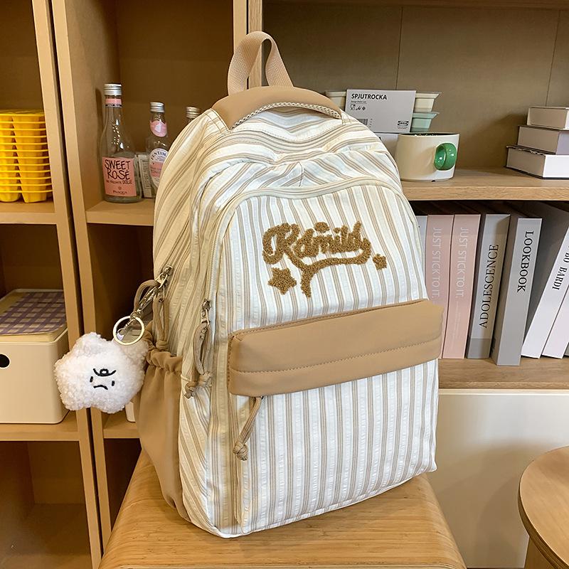 New high-value, fresh and sweet candy-colored striped backpack, high school student large-capacity backpack.