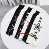 Women's Punk Star Pattern Knitted Leg Warmers with Ribbon Bows Flared Boot Covers Knee Length Socks Japanese Streetwear
