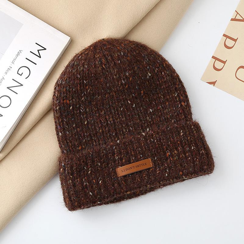 Autumn and winter pullover warm wool hat women's fashion leather label knitted confinement hat outdoor cycling sports hat