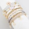 Korean version of fashion stretch line multi-layer bead women's bracelet set retro bohemian fringed pendant hand jewelry women