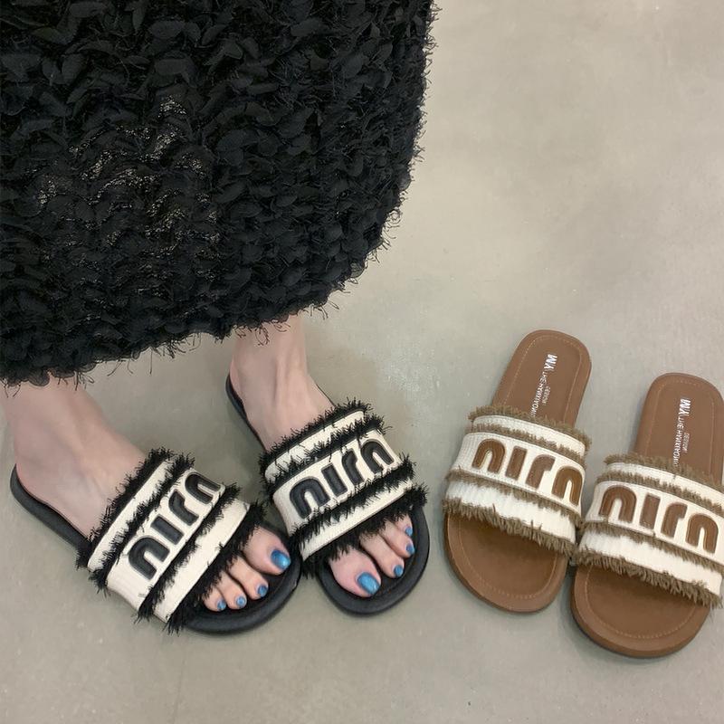

Cool slippers women s new summer outer wear flat-bottomed beach fringed one-word slippers 35