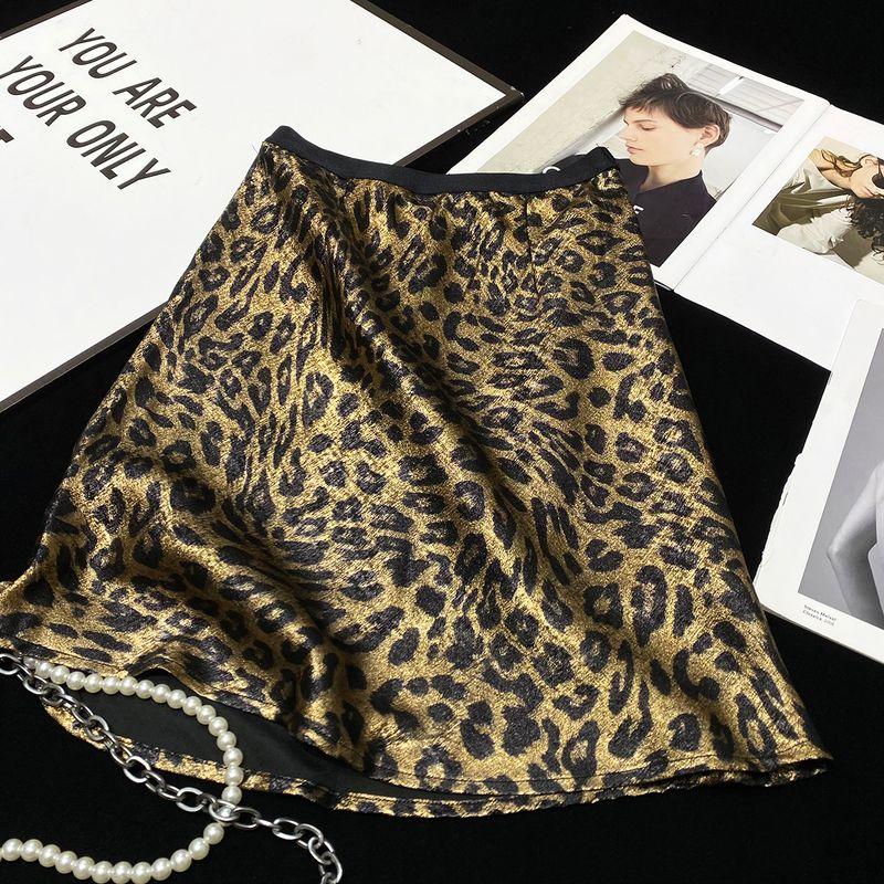 

Имитация шелка и атласа Глянцевая бронзовая Модная юбка с леопардовым принтом Gold L