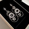 Silver needle European and American knotted round pleated metal fringed pendant earrings versatile stud earrings niche design earrings women
