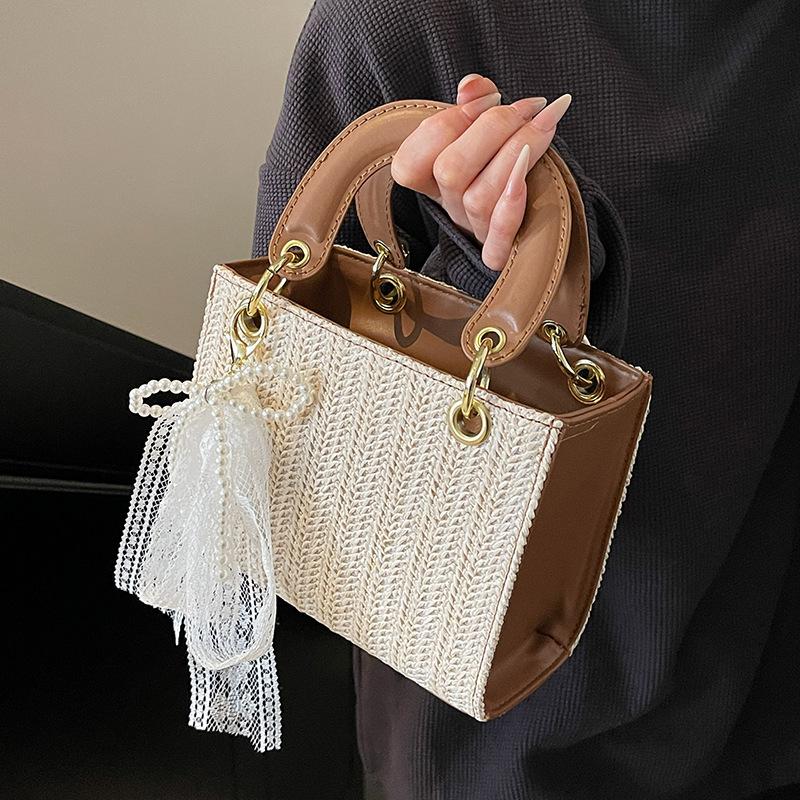2025 new niche design fashion high sense straw woven portable Princess Diana bag foreign style versatile contrasting color messenger women's bag