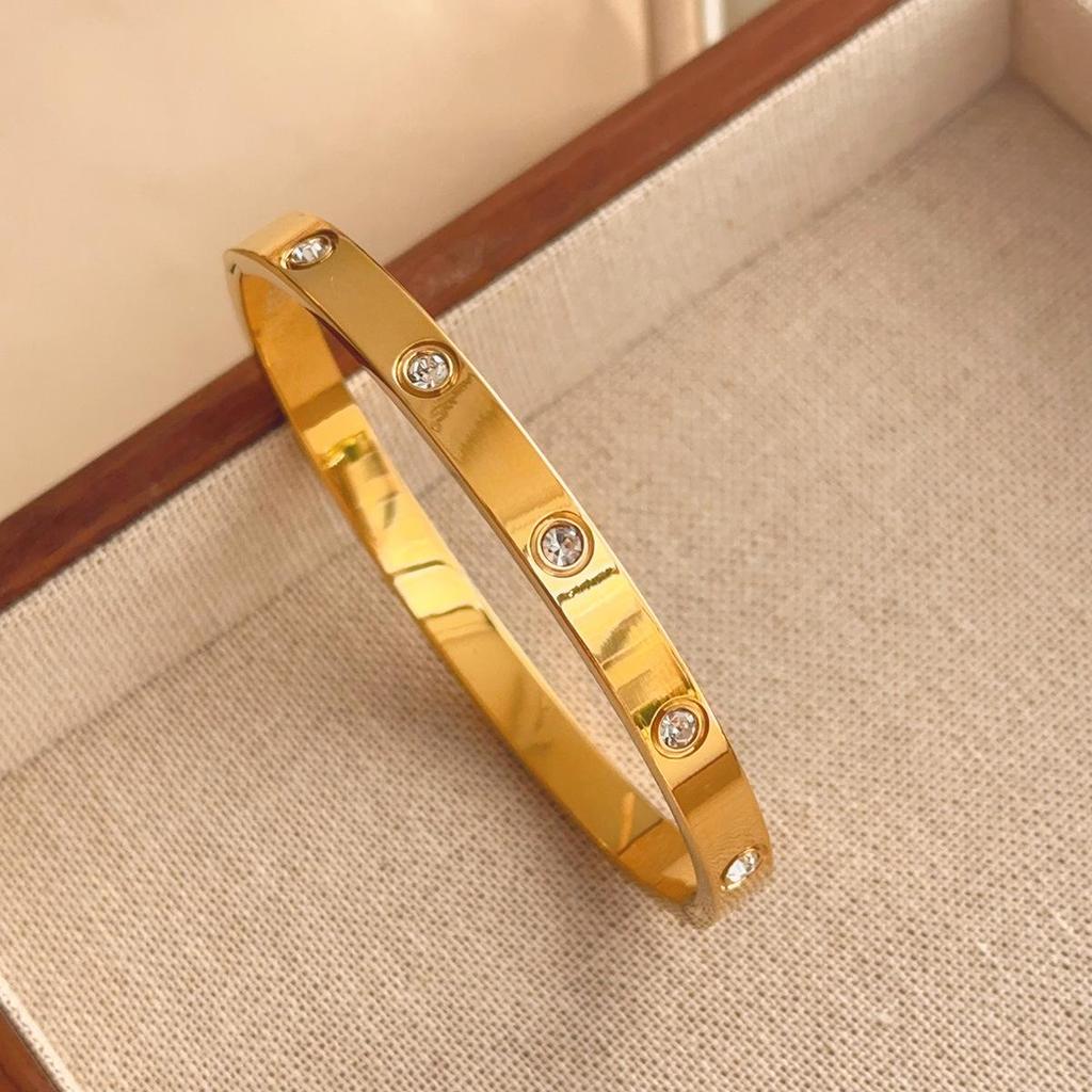 Luxusní dámský náramek z titanové oceli se zirkony a akcenty z bílé perleti