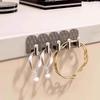 Detachable Mini Adhesive Hooks - No-Punch, Traceless, Wall-Mounted for Cabinet or Door Back Storage