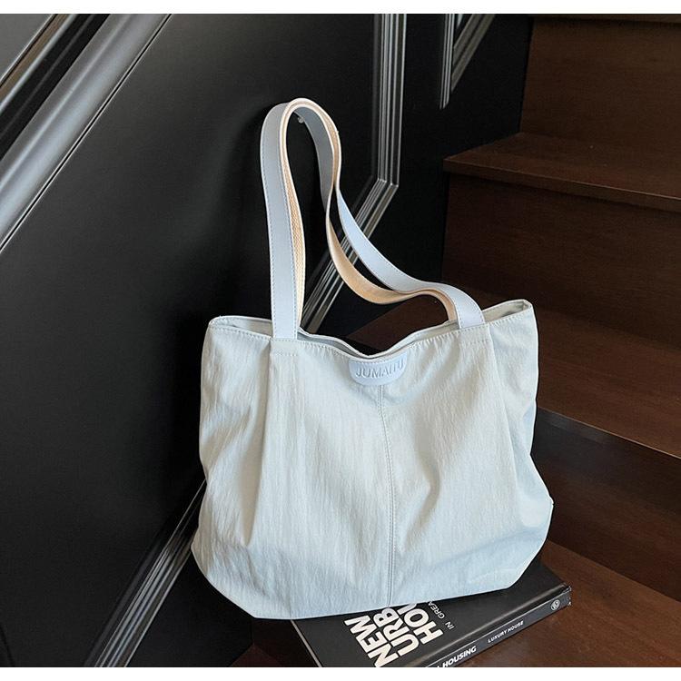 2025 spring and summer large-capacity canvas bag women's casual shoulder bag simple contrasting color versatile niche tote bag