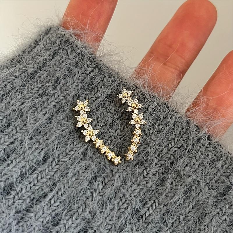 A pair of elegant and luxurious delicate floral stud earrings, fully set with diamonds and rhinestones, perfect as a Thanksgiving gift for women