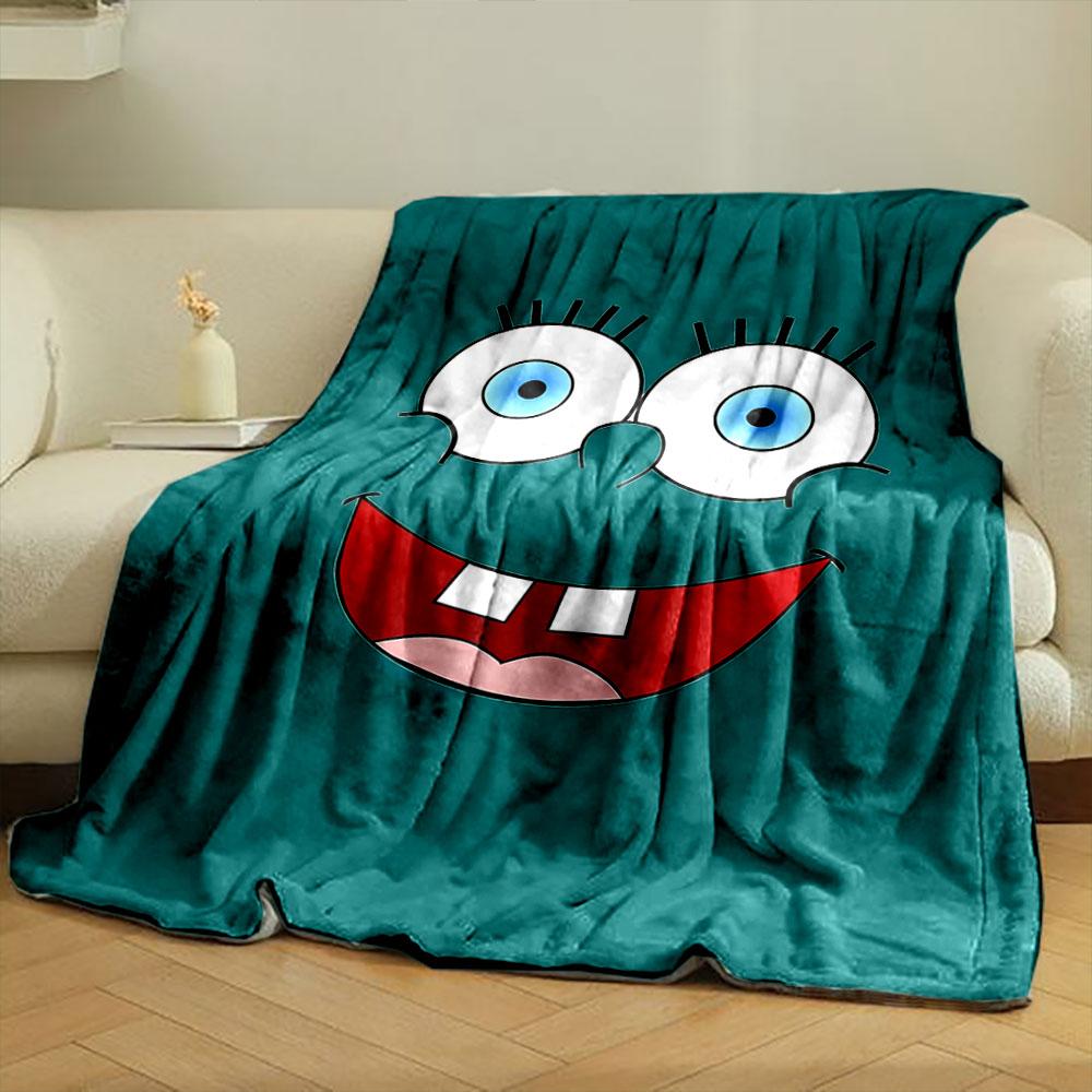 Bright cartoon face with large blue eyes, wide smile, and prominent teeth. for all seasons blanket lunch break throw gift