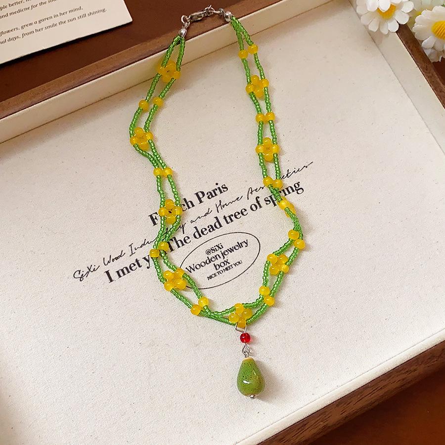 Retro Ethnic Heart Necklace: Wooden Flower Pendant Sweater Chain for Women