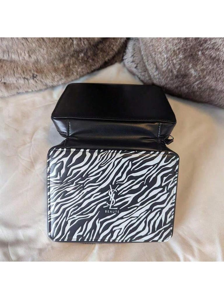YSL Makeup Bag, Featuring a Zebra Print Design and Zipper Closure, Suitable for Everyday Use, Work, Travel, and School.