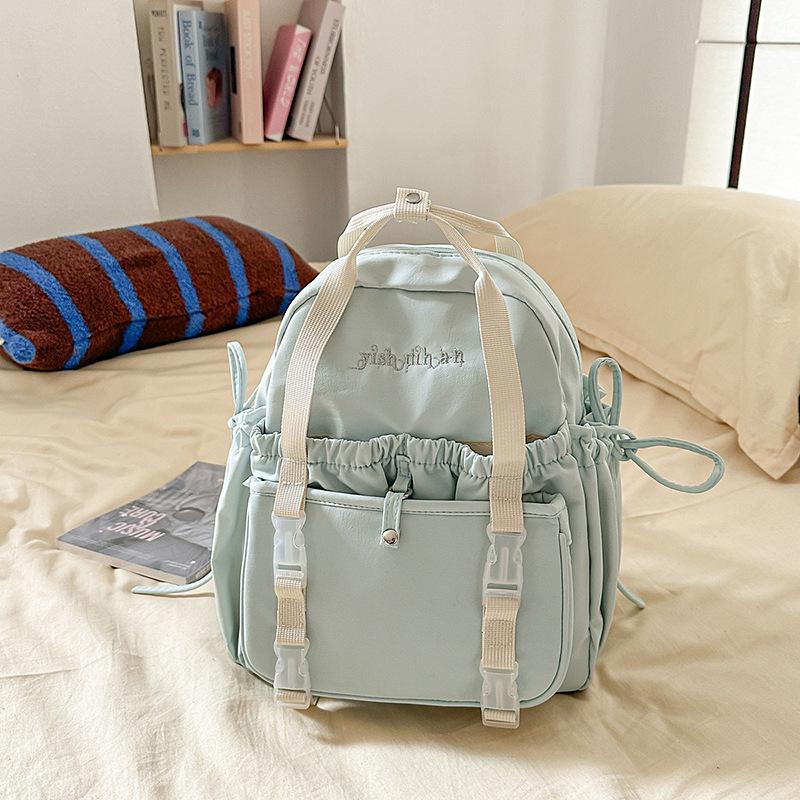 Student Rucksack mit großem Fassungsvermögen, lässig, mit Cartoon-Anstecknadeln, für Reisen und Schule