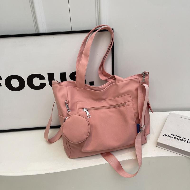 Japanese-Style Canvas Crossbody Bag: Double Pocket, Large Capacity, Women's Tote, Solid Color, Perfect for Students and Commuting.