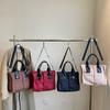 New simple commuter style haute couture anti-splashing nylon material single shoulder oblique span portable multi-functional women's bag