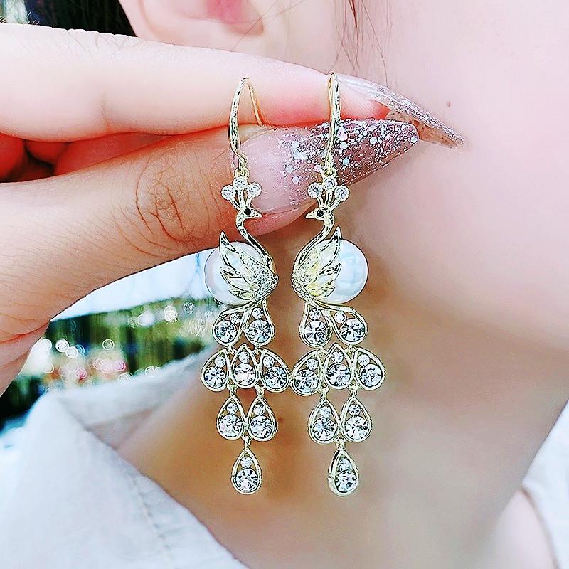 Chinese Cat s Eye Zircon Tassel Earrings - Elegant Dangle Design for Slimming Long Face