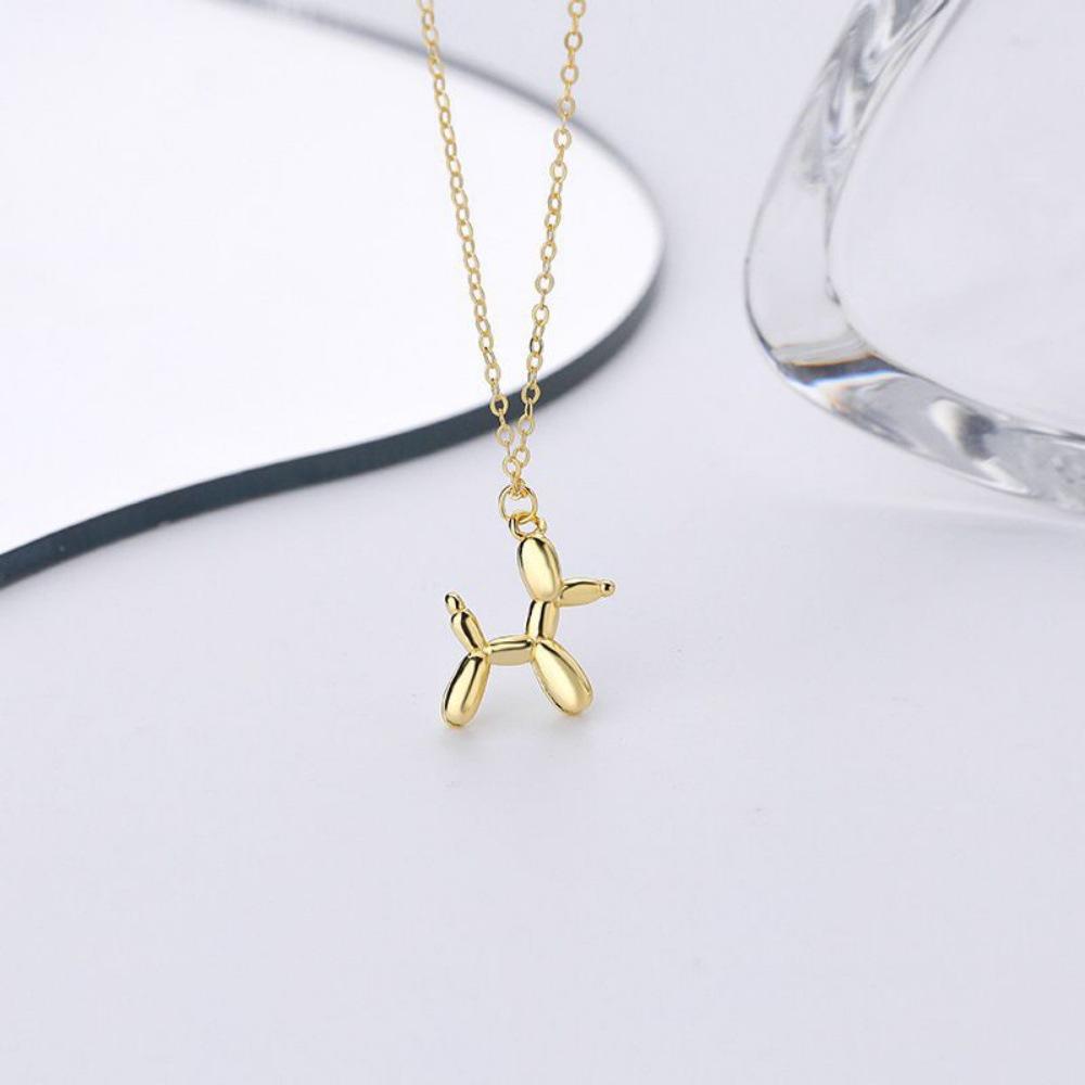 Gold-Tone Balloon Dog Pendant: Smooth lines, vivid form, finely polished, comfortable fit, natural color.
