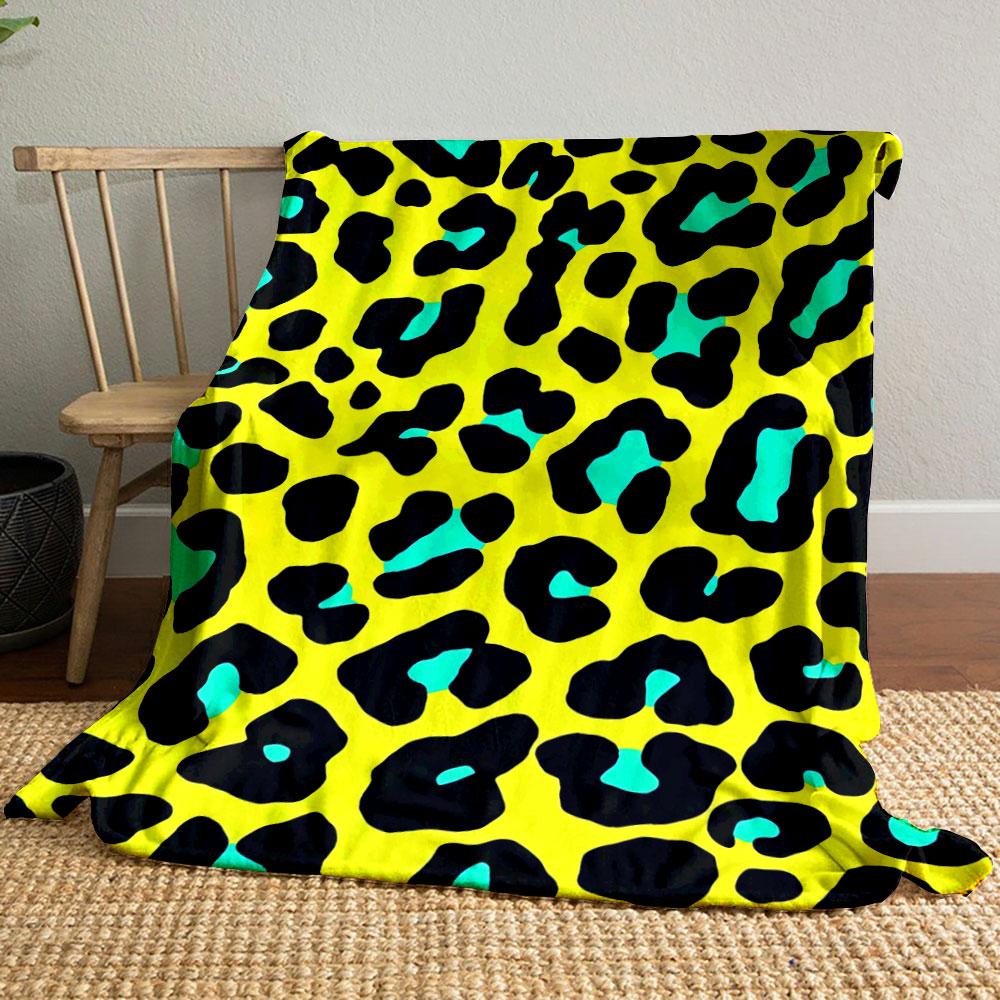Black leopard spots with turquoise accents on a bright yellow background. for all seasons blanket lunch break throw gift