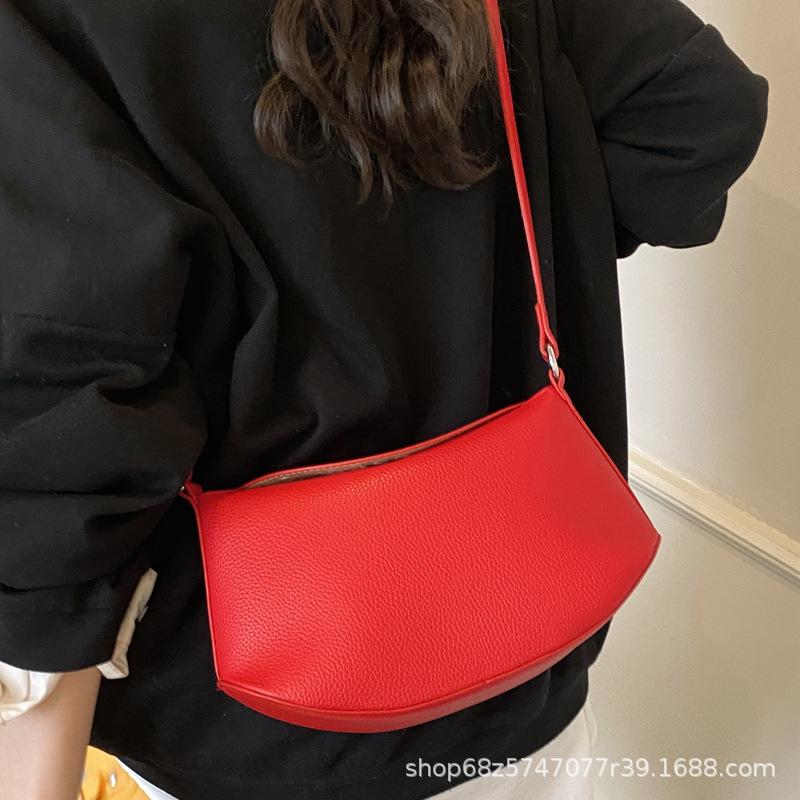 Niche design dumpling armpit bag 2025 summer new shoulder messenger bag high-end versatile lychee pattern saddle bag