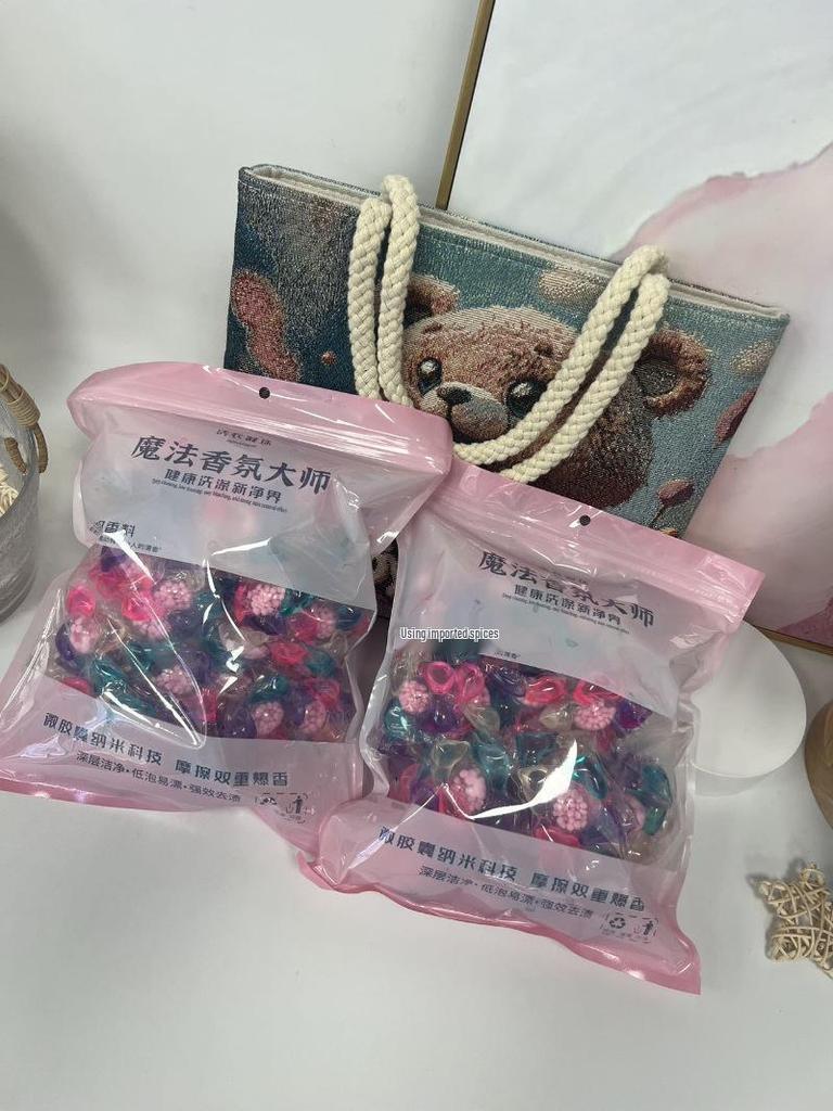 DM Camellia Scent Laundry Pods with Long-Lasting Fragrance, Stain Removal, and Softening Beads.