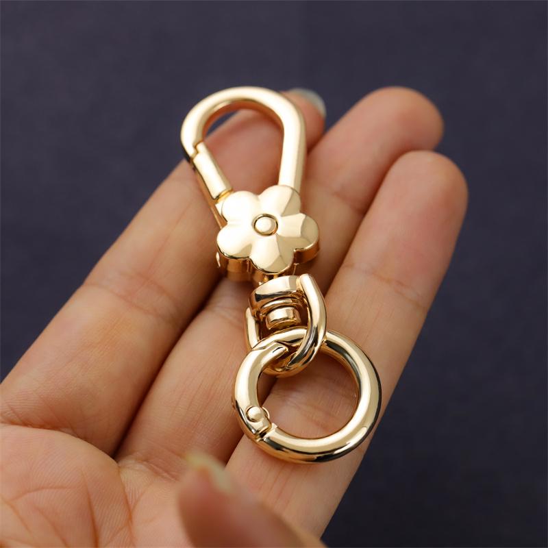 

Women s Multi-purpose Flower Metal Keychain Pendant with Anti-loss Hook for Handbags & Luggage