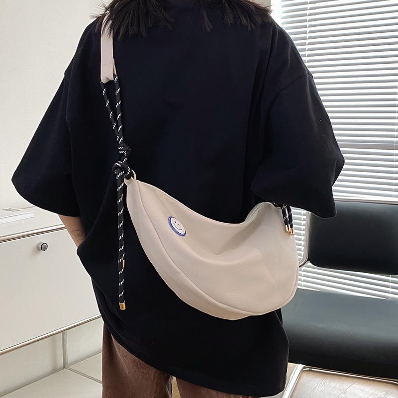 Simple dumpling bag casual 2025 new student schoolbag men's and women's shoulder messenger bag