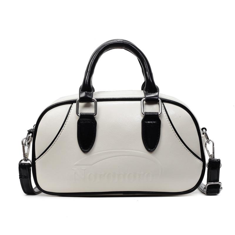 2025 new Korean simple contrasting color portable Boston bag casual commuting versatile foreign style niche messenger women's bag