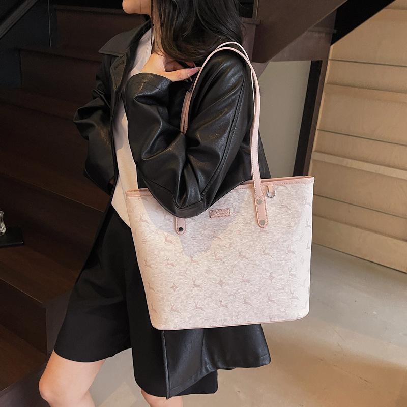 

Premium sense of work commuter bag New simple casual armpit bag Fashion printed portable tote bag розовый