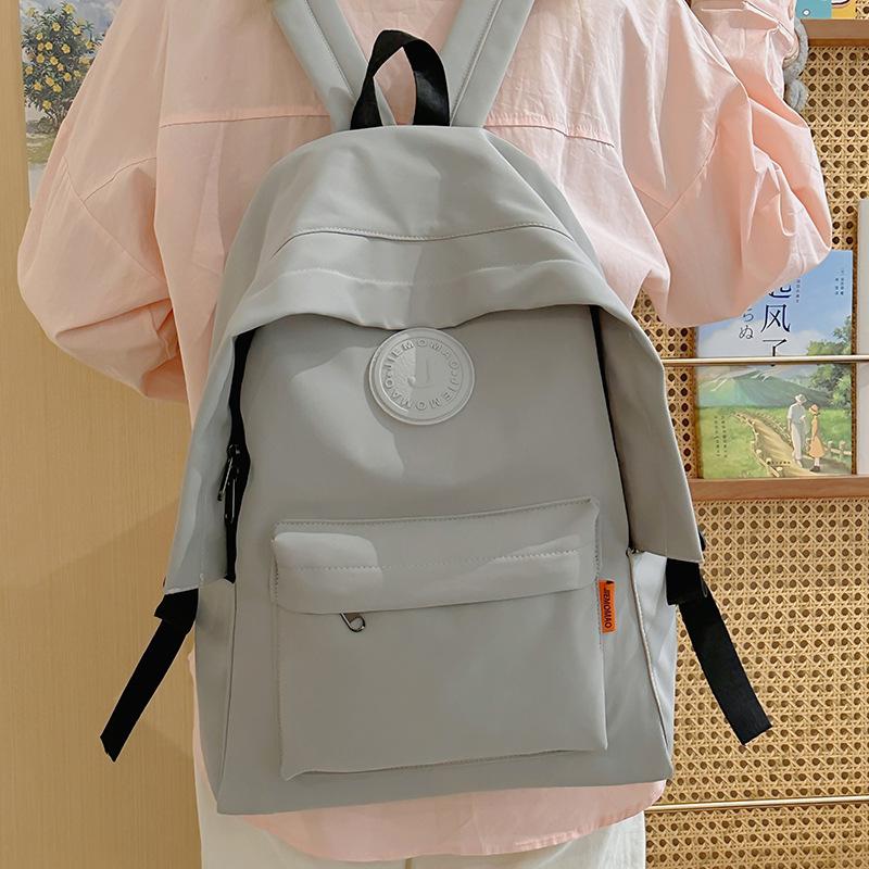 Stylish simple large-capacity couple student schoolbag new junior high school high school student backpack fashion