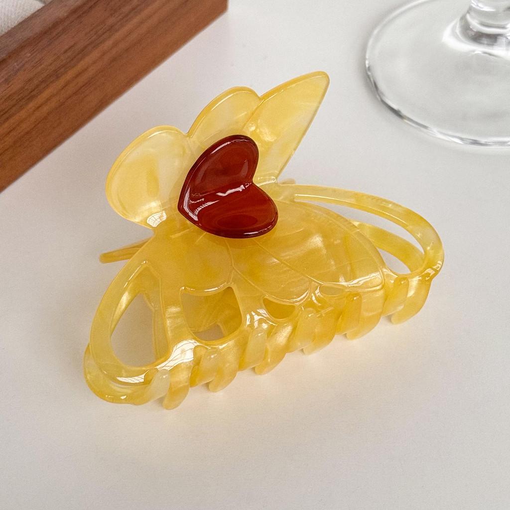 Dorei Accessories Snygg Hårklämma i Acetat med Hjärta och Fjäril för Eleganta Uppläggningar