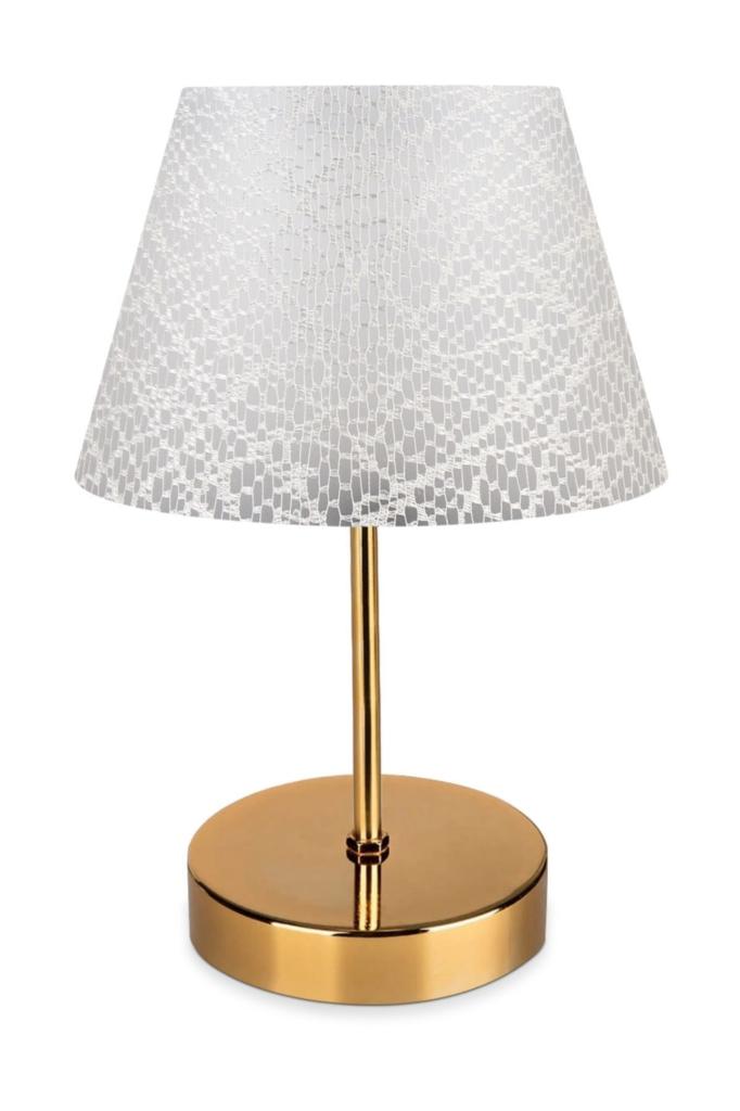 

Изголовье абажура с золотым корпусом, покрытое тканью с кружевным узором