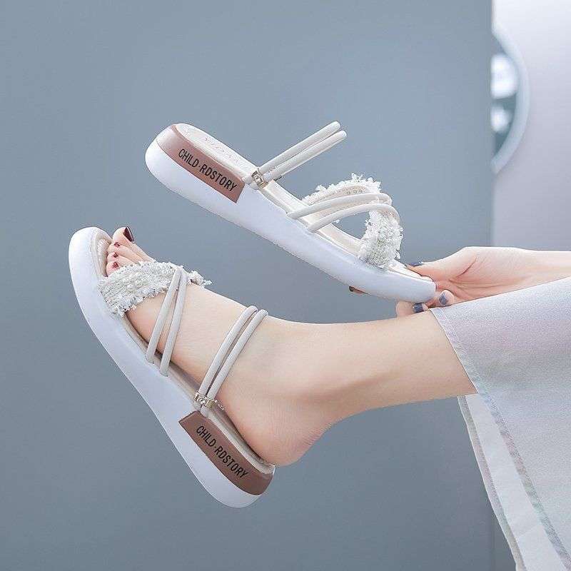 Two women wearing sandals in the summer of 2025, the new sports mid-heel wedge heel muffin thick-soled Roman pregnant women's flat-soled women's shoes
