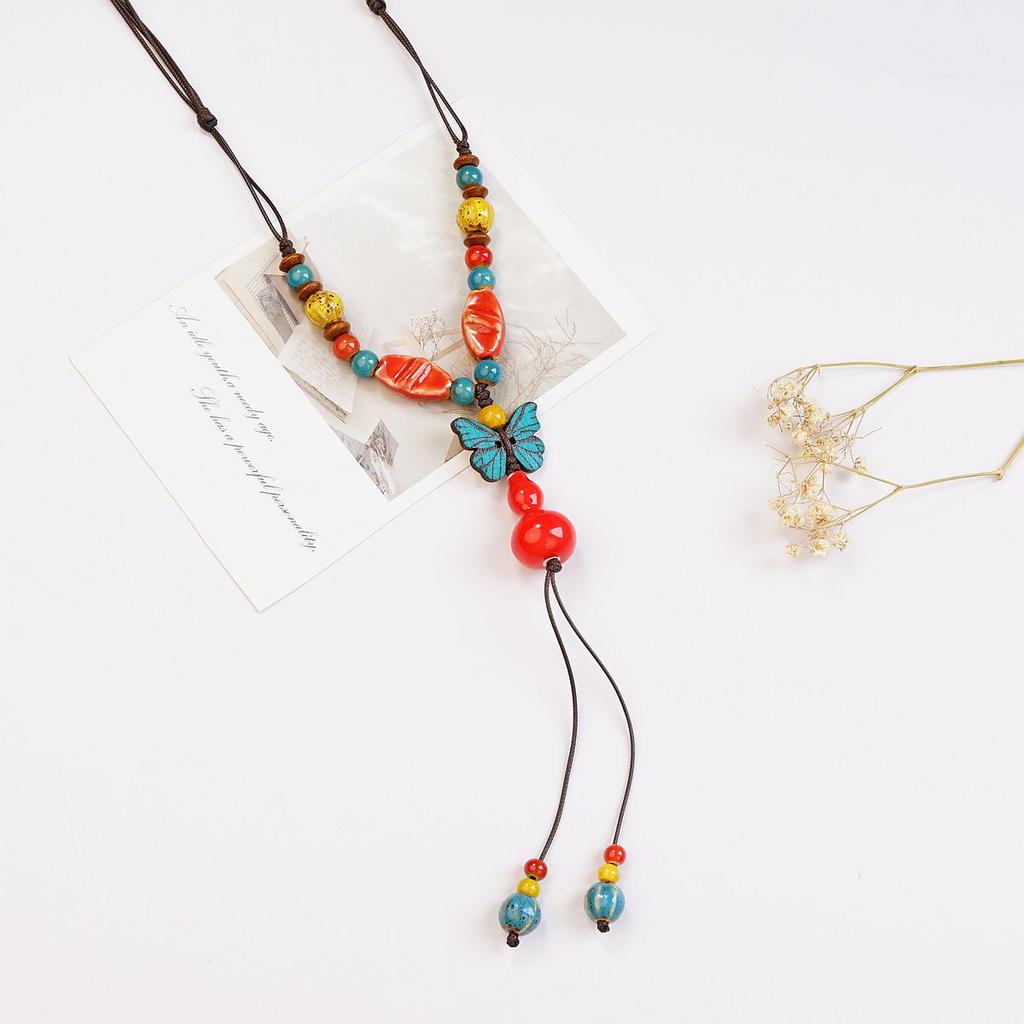 Ethnic style ceramic butterfly bell pendant necklace design sense new trendy long sweater chain