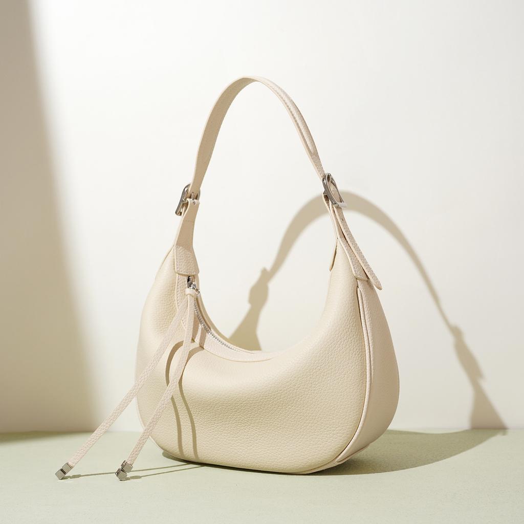 Modă 2025 design simplu de nișă geantă semilună nouă geantă de umăr din piele textură portabilă geantă messenger geantă de damă