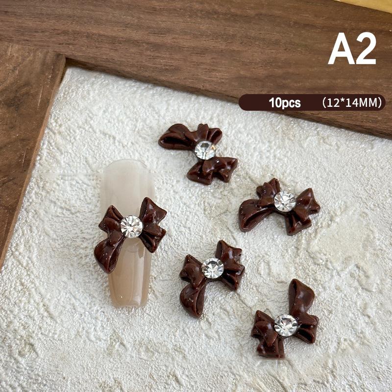 

10 шт. Лента смоляные банты части ногтей подвески бант стразы ювелирные изделия 10-13 мм аксессуар для маникюра своими руками декор A2