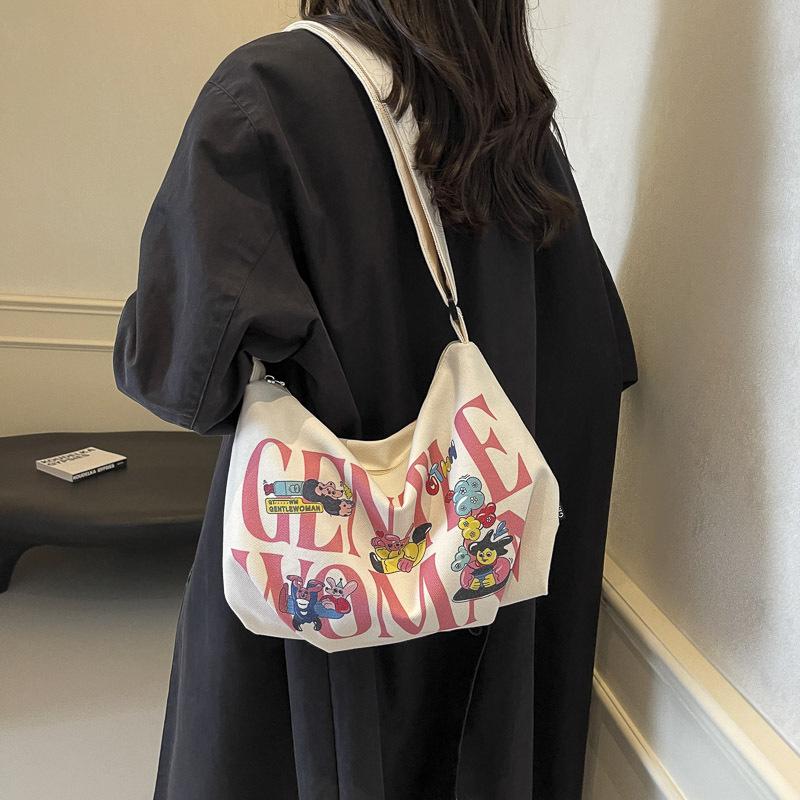 Alphabet canvas bag women's large capacity 2025 new casual handheld cloth bag student class shoulder bag leisure bag