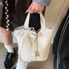 Simple temperament lychee pattern portable bucket bag casual light luxury solid color high-end messenger bag bag female