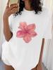 Women's White Graphic Tee with Pink Hibiscus Print for Tropical Themed Events and Summer Outings Women Clothing