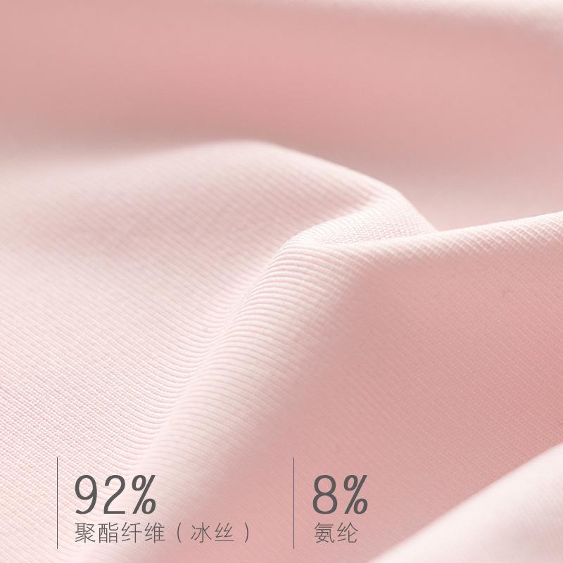 Haut d'été sans coutures à fines bretelles pour femme, polyvalent et sans manches, idéal comme base pour une coiffure tendance.